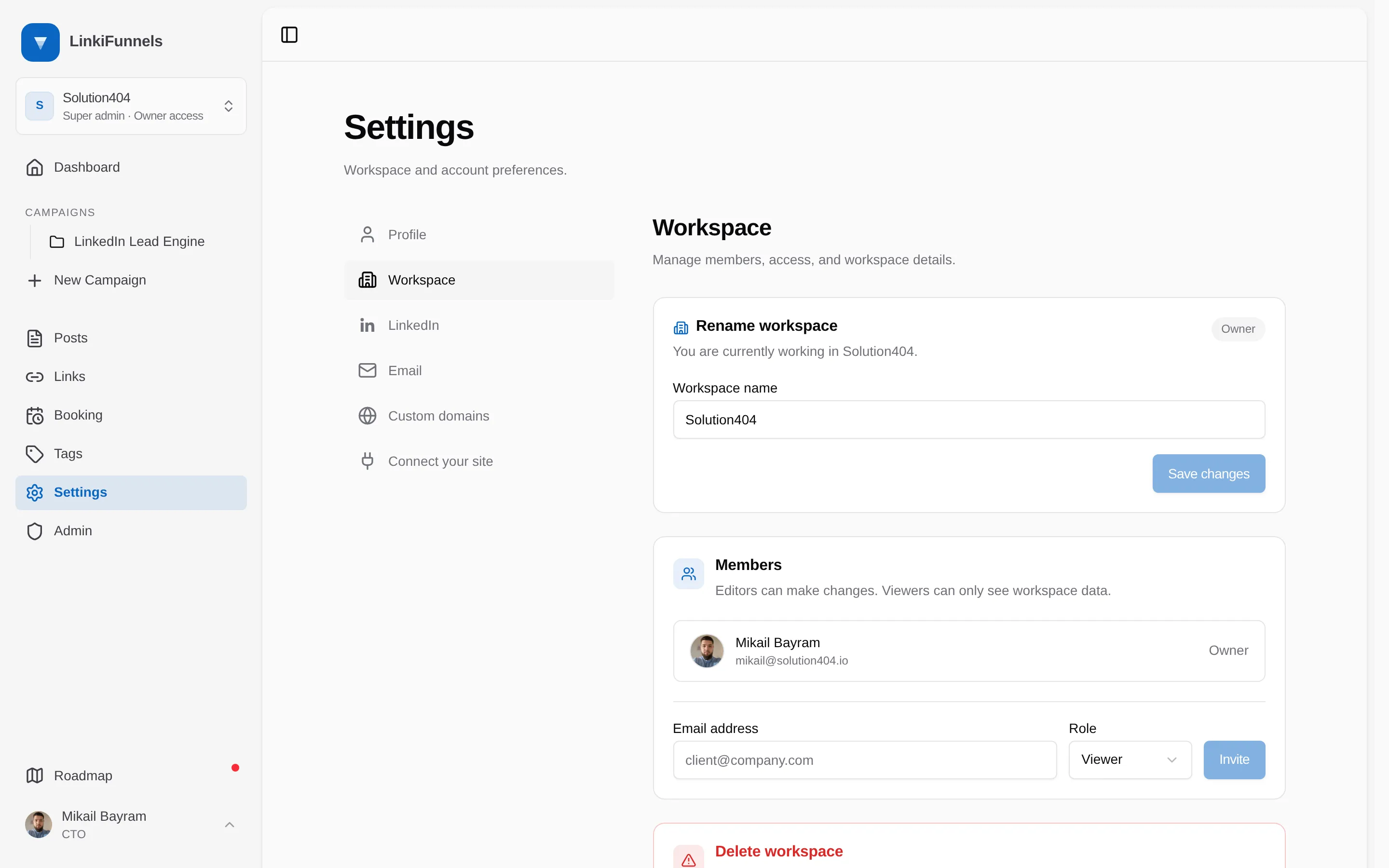 The workspace members card with the email field, the role selector, and the Invite button marked